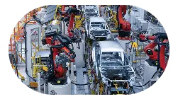 Automated car assembly line with robotic arms assembling vehicles where edge ai deployment required